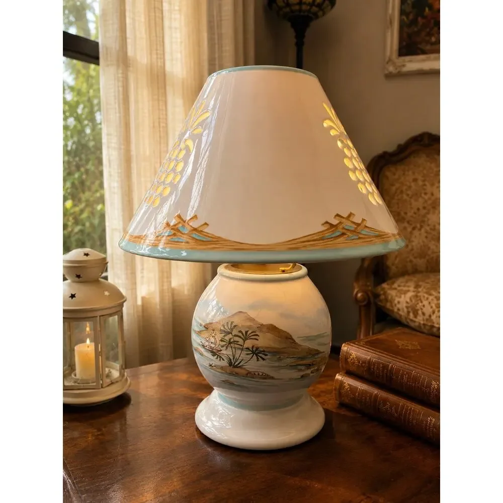 Lenox British Colonial candle lamp featuring a scenic design by Chuck Fischer